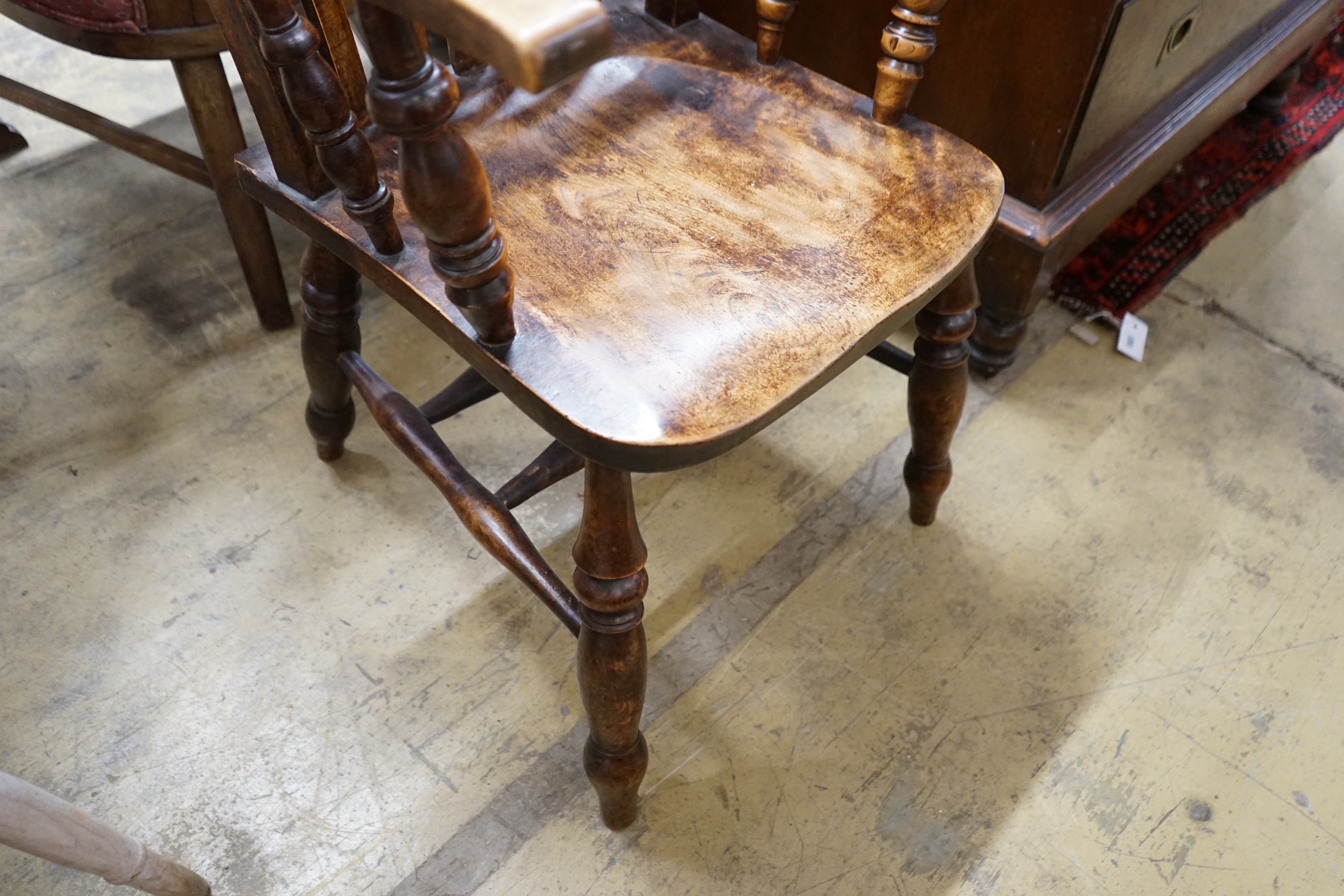 A Victorian elm and beech Windsor lathe back armchair, width 58cm, depth 46cm, height 115cm